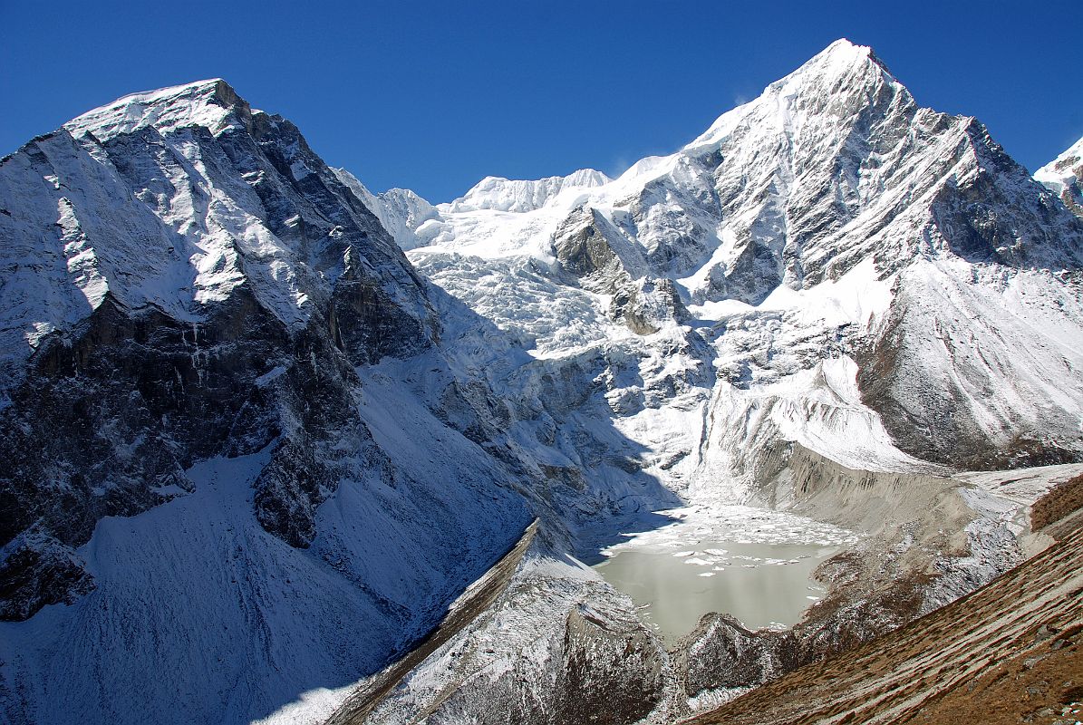 33 Tsha Tung, Madiya Peak Bhairab Takura and Eiger Peak Frame A Glacier And a Glacial Lake From Ridge Above Shingdip Tsha Tung (5995m), Bhairab Takura (6799m, Madiya Peak) and Eiger Peak frame a glacier and a glacial lake from the ridge above Shingdip.